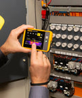 Technician using PTi120 Pocket Thermal Imager For Quick Infrared Inspections And Temperature Scans On The Go on electrical panel