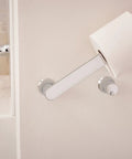 Genta LX Modern Wall Mount Pivoting Toilet Paper Holder in Chrome for Bathroom with easy roll change feature.