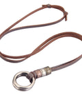 Top Shelf Handcrafted Leather Necklace For Men And Women Boasting A Fly Vintage Hippie Design With Adjustable Long Cord And Smooth Durable Alloy Cross Pendant In Classic Brown, featuring a brown leather cord with a metal ring pendant.