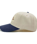 Side view of women's breathable cap with adjustable buckle perfect for running hiking cycling and everyday wear, off-white with navy peak