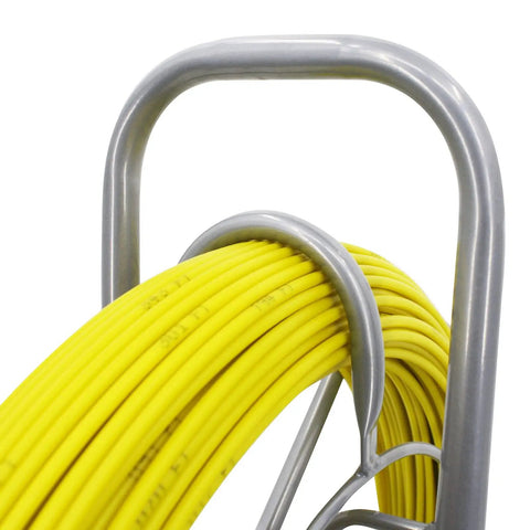 Close-up of a fiberglass duct rod fish tape puller kit with 6mm diameter and 450 feet on a beefy steel reel stand for electrical wiring.