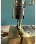 Close-up of Joverex Multifunction Micro Watch Bench Drill Press With Adjustable Voltage And Variable Speed Up To 9500Rpm drilling a jewelry component.