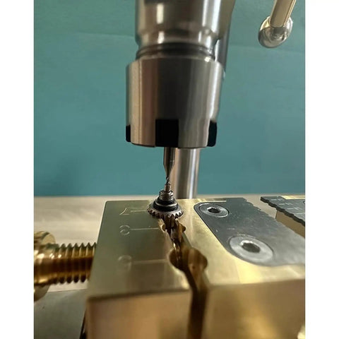Close-up of Joverex Multifunction Micro Watch Bench Drill Press With Adjustable Voltage And Variable Speed Up To 9500Rpm drilling a jewelry component.