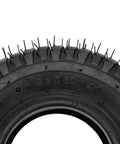 Close-up of 9x3.50-4 tire tread for Mini ATV Quad Go Kart Heavy Duty Petrol Electric Gas Skateboard Scooter with bent valve stem