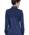 Back view of Women's Zip Front Scrub Jacket With High Low Hem, Mesh Detail, 3 Pockets, navy, showing shoulder panels.