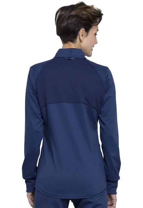 Back view of Women's Zip Front Scrub Jacket With High Low Hem, Mesh Detail, 3 Pockets, navy, showing shoulder panels.