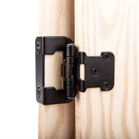 Close-up of a mounted 25 Pair Set of Self-Closing Half Inch Overlay Cabinet Hinges in Black, Semi Partial Wrap for Face Frame Kitchen Cabinets