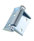Close-up of industrial high-capacity self-closing hinge with large coil spring on a metal mounting plate