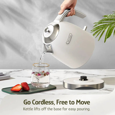 Pouring water from 1.7L Electric Kettle With Stainless Steel Interior, BPA-Free, 1200W Fast Boil, Cordless With Rotational Base, Pearl White