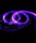 Lit Fiber Optic Space Dancing Light Whip With Rechargeable LED glowing in purple, 5.9Ft length, ideal for EDM festivals and parties