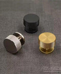 Kick Up Your Kitchen Game With These Solid Modern Brushed Brass Cabinet Knobs Perfect For Drawers And Cupboards Snag This Top Tier 10 Pack Hardware Set For A Fresh Upgrade. Three cabinet knobs in brushed brass, black, and silver finishes on a fabric background.
