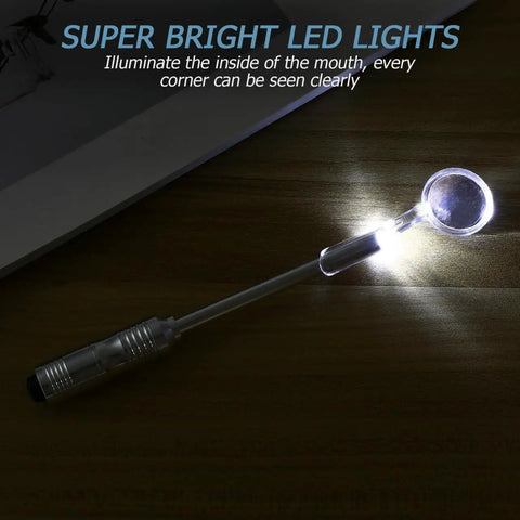 LED Lighted Stainless Steel Mouth Mirror For Teeth Inspection And Plaque Removal with illuminated head on wooden surface