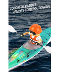 Remote Control Kayak Dope 2.4G Anti Capsize RC Boat For Adults in action on water, featuring realistic paddle propulsion, hobby grade.