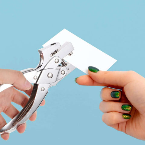 Handheld Metal Hole Puncher For Office And Crafts used on paper, titanium alloy tool for single-hole punching, close-up view