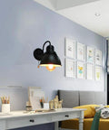 Modern room with Dope Industrial Loft Gooseneck Wall Sconce In Black Metal With Pull Chain Switch illuminating a workspace.