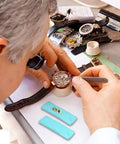 Watchmaker using Timepiece Cleaning Putty For Watches Pro Grade Dry Clay Bar on watch movement parts with tools.
