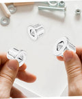 Hands holding Pro Grade Stainless Steel Dowel Pin Set With Centering Pins For Precise Woodworking Alignment Cabinet And Bookshelf
