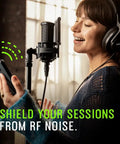 Woman singing with headphones using Studio Quality Condenser Microphone Kit For Home Recording With XLR, all-metal construction.
