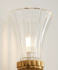 Solid Copper Wall Sconce Clear Textured Glass Shade Matte Black With Brushed Gold Trim Heavy Duty Indoor Lighting Fixture For Primary Bedroom Living Space Hallway Entryway Straight Fire Glow, close-up of textured glass shade.