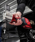 Hand using M12 Cordless Rivet Tool Kit for No Fuss Riveting on Aluminum, Steel And Stainless Rivets