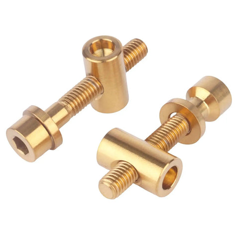 Hella Durable Grade Five Titanium M5x30mm Bolts With Smooth Flat Washers And Secure Hex Nuts in shiny gold finish.