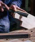 Person using Jhknnk 5pc Premium Dry Wet Sandpaper Set Featuring Tear-Resistant Silicon Carbide Sheets for sanding wood. 