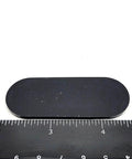 Two And A Half Inch Oval Silicone Rubber Bumper Feet One Eighth Inch Thick With Adhesive Backing next to a ruler for scale.