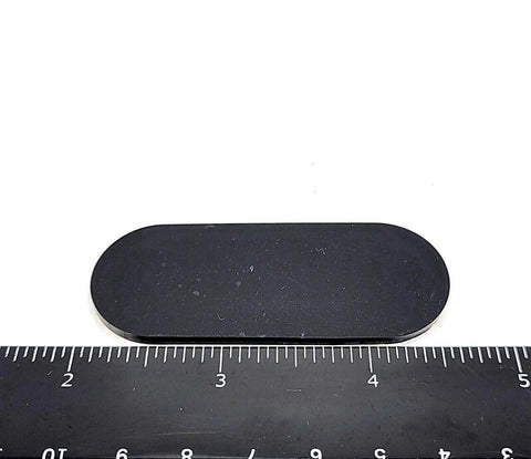 Two And A Half Inch Oval Silicone Rubber Bumper Feet One Eighth Inch Thick With Adhesive Backing next to a ruler for scale.