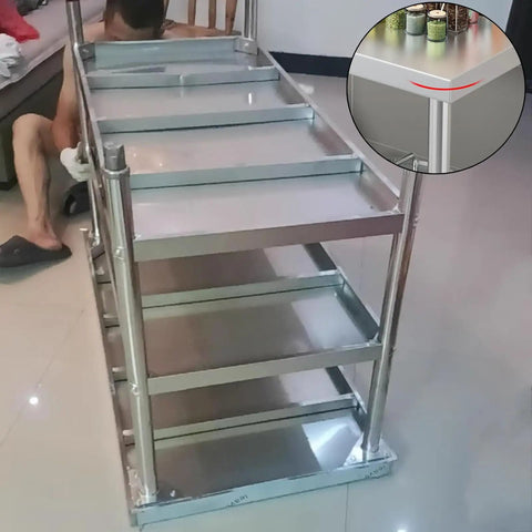 Beefy Stainless Steel Workbench With Three Tier Open Shelving And No Fuss Leveling Feet, showcasing robust construction and shelving.