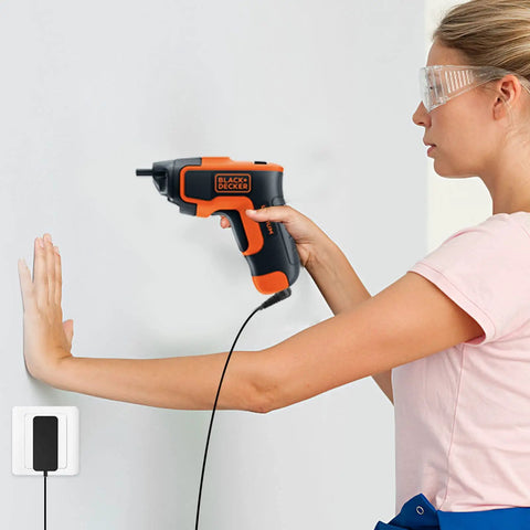 Woman using Go To 10V Charger Replacement Power Adapter For Black And Decker Li2000 Li3100 Cordless Screwdriver And Drill Models 90593303 90593303 01 Compatible 100 240V AC Input And 10V 100mA Output to drill into wall