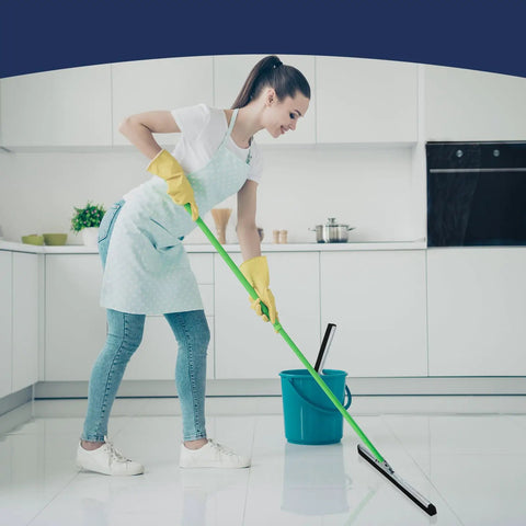Woman cleaning kitchen floor with 4 Pack Double Foam Floor Squeegee For Concrete And Industrial Floors, Heavy Duty Stainless Steel Scrubber With EVA Foam Blade, 18 Inch Wide, Great For Garage, Pool Deck, Windows And More.