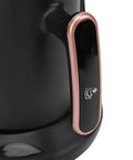 Close-up of Turkish Coffee Maker Portable Auto Brewer For Home Office Travel And Camping, black handle with copper trim