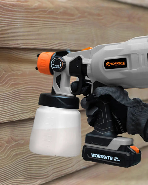 Cordless 20V Paint Sprayer Gun With Dual Batteries, HVLP Sprayer, Adjustable Valve Knob in use against wooden surface