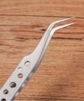 Curved tip of the Five Piece Stainless Steel Tweezers Set For Electronics Repair And Crafting With Anti Slip Grip Non Magnetic Tips
