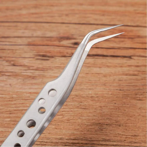 Curved tip of the Five Piece Stainless Steel Tweezers Set For Electronics Repair And Crafting With Anti Slip Grip Non Magnetic Tips
