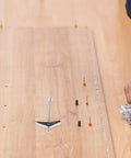 Heavy Duty Galvanized Toggle Bolts And Wing Nuts Kit with 1/4, 3/16, 1/8 inch screws and anchors on wooden surface