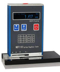 Heavy Duty Digital Surface Roughness Tester Delivering Legit Ra Rz Measurements For All Metal And Nonmetal Finishes With Sweet High Speed Dsp Processing And Knockout Aluminum Build For Daily Shop Grind on a black stand with OLED screen.