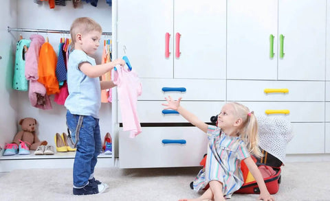 Kids interacting near a wardrobe featuring Super Cute Soft Rubber Cabinet Handles 5 Inch Long with Zinc Alloy Base.