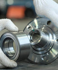 Hands holding 6806-2RS Sealed Ball Bearings 30mm ID x 42mm OD x 7mm Width, Double-Sided 2RS Chrome Steel GCr15, next to a metal component