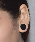 Black Silicone Ear Gauges 25mm 1 Inch Tunnels Plugs Set For Ears Stretching Kit shown in ear, highlighting soft non-toxic material