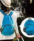 Woman wearing a blue lightweight 20L waterproof hiking backpack with multiple pockets, foldable travel daypack for camping and outdoor adventures