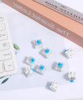 30 Piece Blue Mechanical Keyboard Switches Pack With 3 Pin Pre Lubed Clicky Key Switches, shown with a keyboard