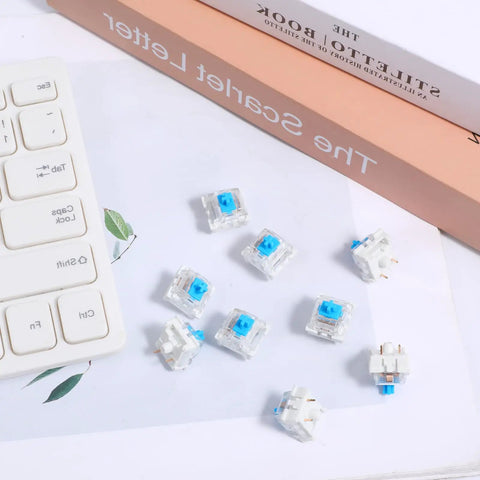 30 Piece Blue Mechanical Keyboard Switches Pack With 3 Pin Pre Lubed Clicky Key Switches, shown with a keyboard