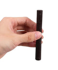 Hand holding one of the 2 Pack Wood Filler Sticks for Furniture Repair Scratch Remover Pens Quick Fix Paint Markers