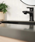 Flute Matte Black Bathroom Faucet With 0.5 GPM Flow Fits 1 Or 3 Hole 4 Inch Install Includes Base Plate And Pop Up Drain ADA Compliant