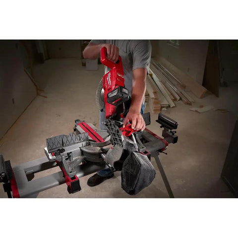 Person using Beast Mode 18 Volt Fuel Lithium Ion Brushless Cordless 10 Inch Dual Bevel Sliding Compound Miter Saw Kit With Free 9Ah Battery for cuts.