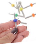 Hand holding blue-capped bit from 30 Piece Micro Drill Bit Set For PCB And Jewelry Pro Grade Precision Hand Drill Engraving Kit Tungsten Steel Bits Tiny Diameter Bits For Circuit Boards Stone Settings And Fine Crafting Projects.
