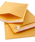 Stack of Gold Kraft Paper Bubble Padded Envelopes Mailers 9.5X14.5 Self-Seal closure shown with protective bubble lining inside