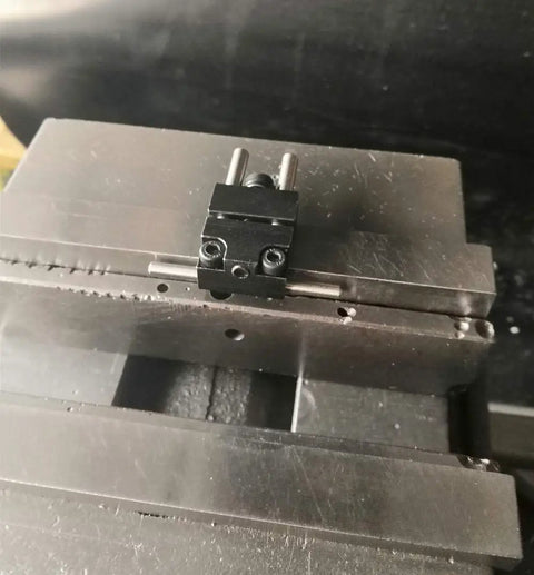 Badass Strength Precision Vise Stop Locators For CNC Milling Machines mounted on steel vise for accurate part positioning.
