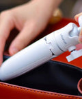 MT-08 White Mini Tripod for Camera with 1 Quarter Inch Mount being placed in a bag